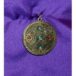 Bronze pendant from Nepal .